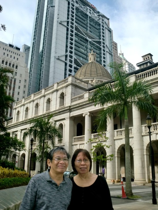 My parents standing in front of the Legislative Council building